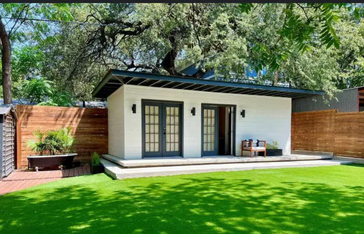 Completed Maricopa Casitas ADU — clean white exterior with lush yard